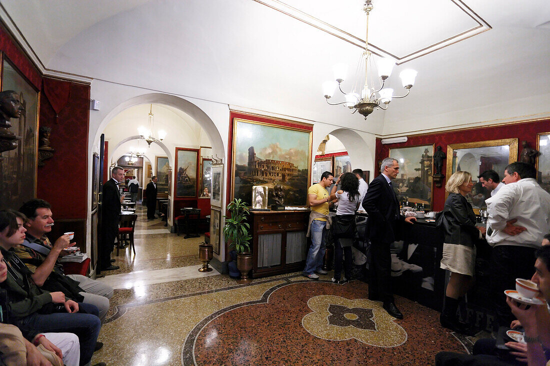 Guests in a cafe at Via Condotti, Rome, Italy