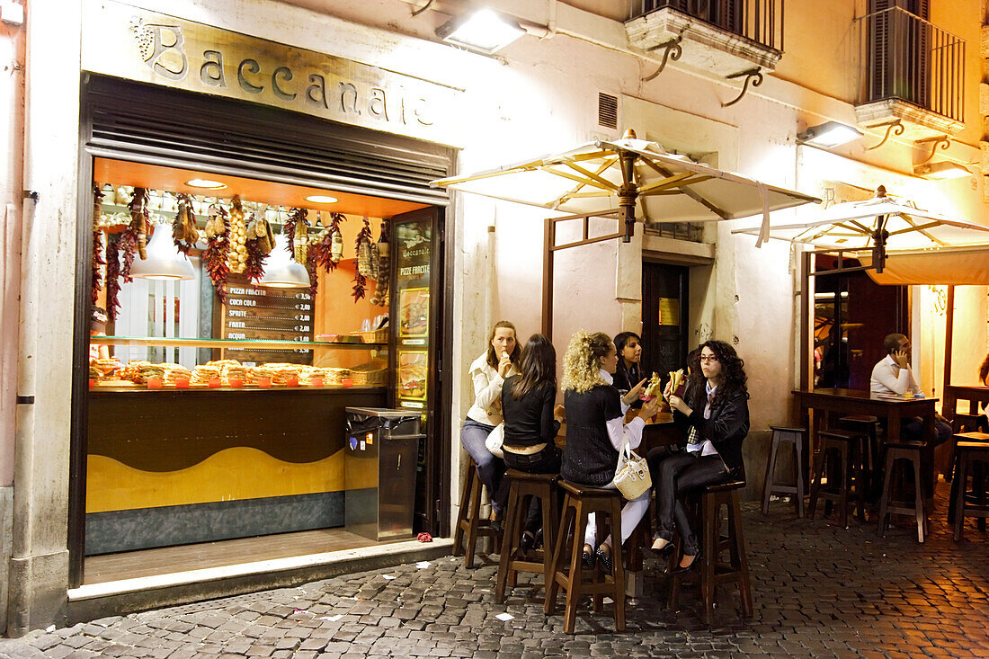 Group of young women outside a restaurant at Campo de Fiori, Rome, Italy