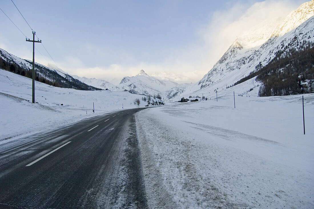 Road through snow-covered Schnalstal valley, South Tyrol, Italy