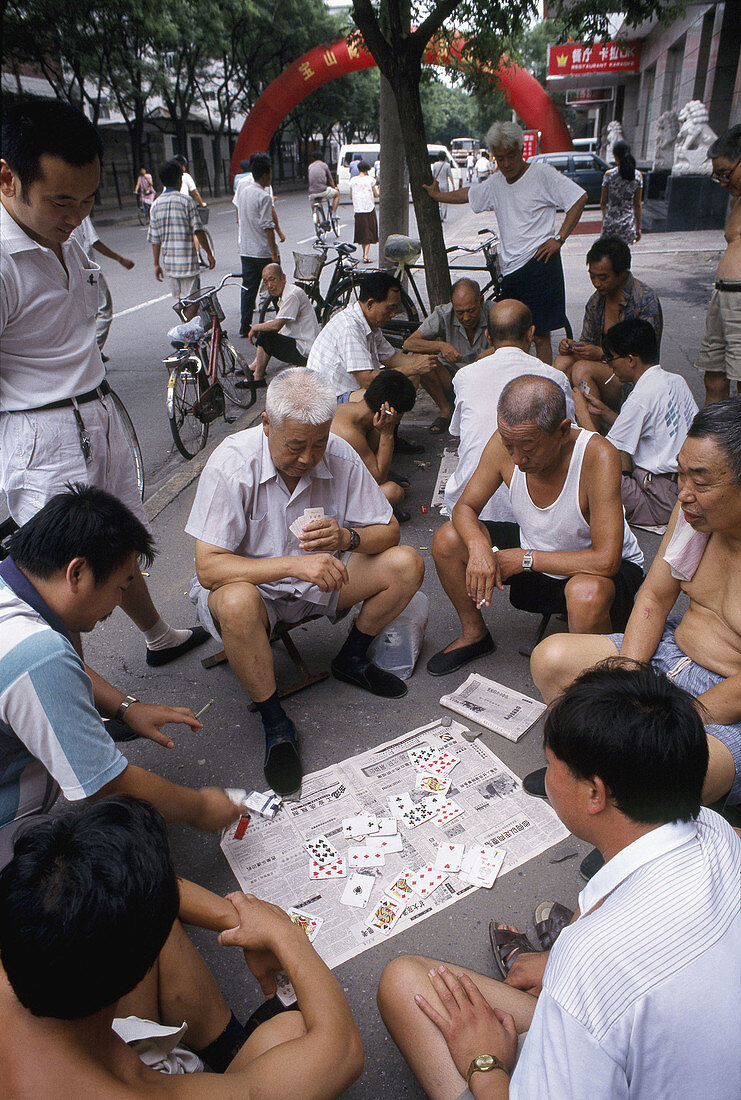 Men playing cards. Beijing. China.