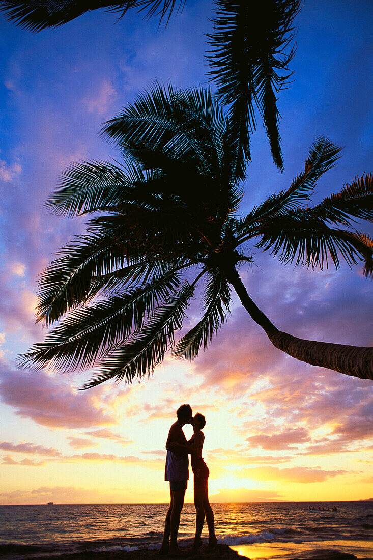 Couple at the beach, sunset
