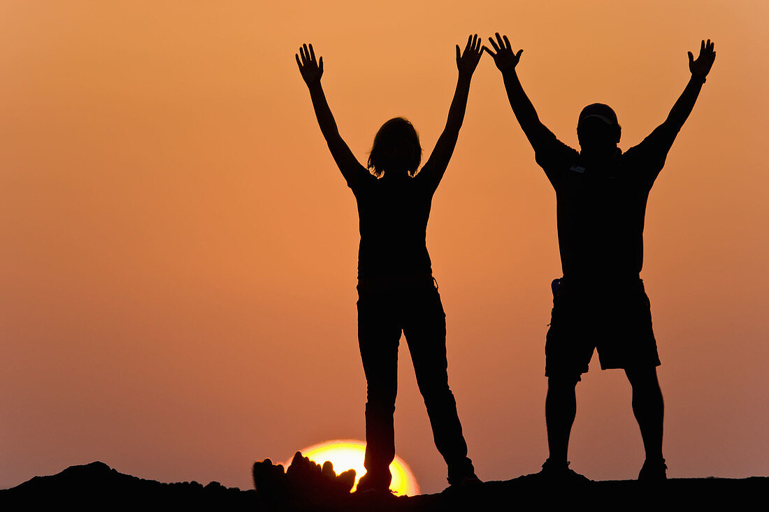 Sunset in the Galapagos on a young couple.