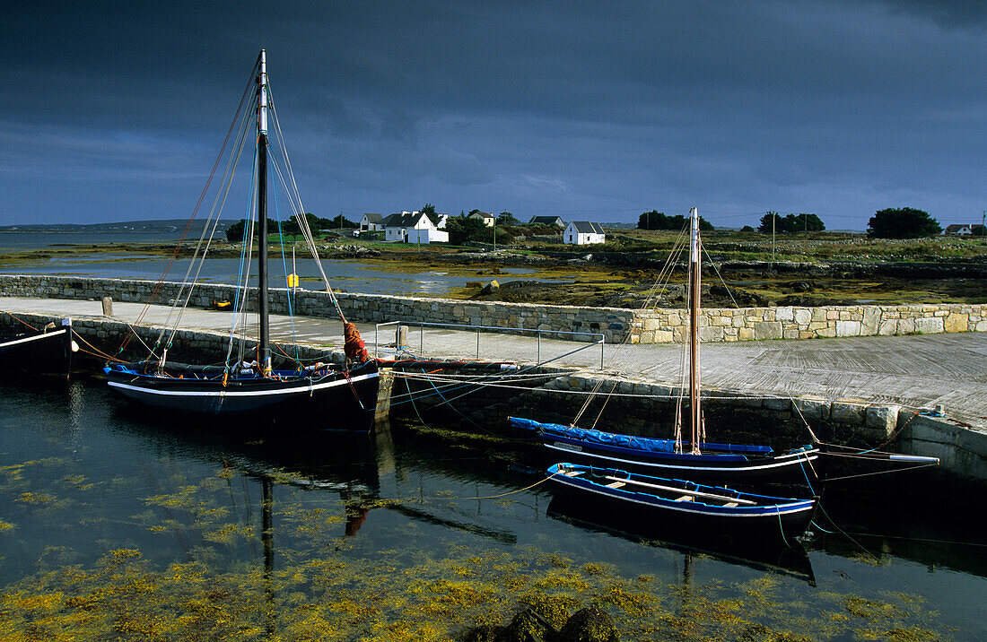 Pier with fishing boats in Lettermore, Connemara, Co. Galway, Ireland, Europe