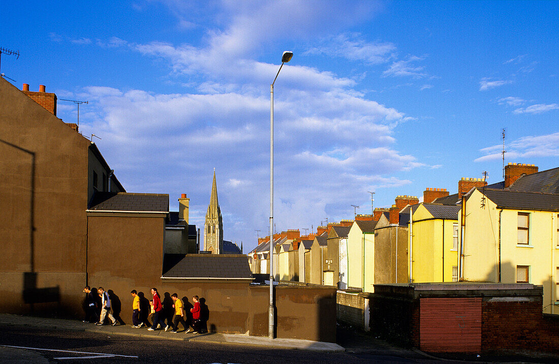 Pedestrians and houses at the Bogside, Derry, County Londonderry, Ireland, Europe