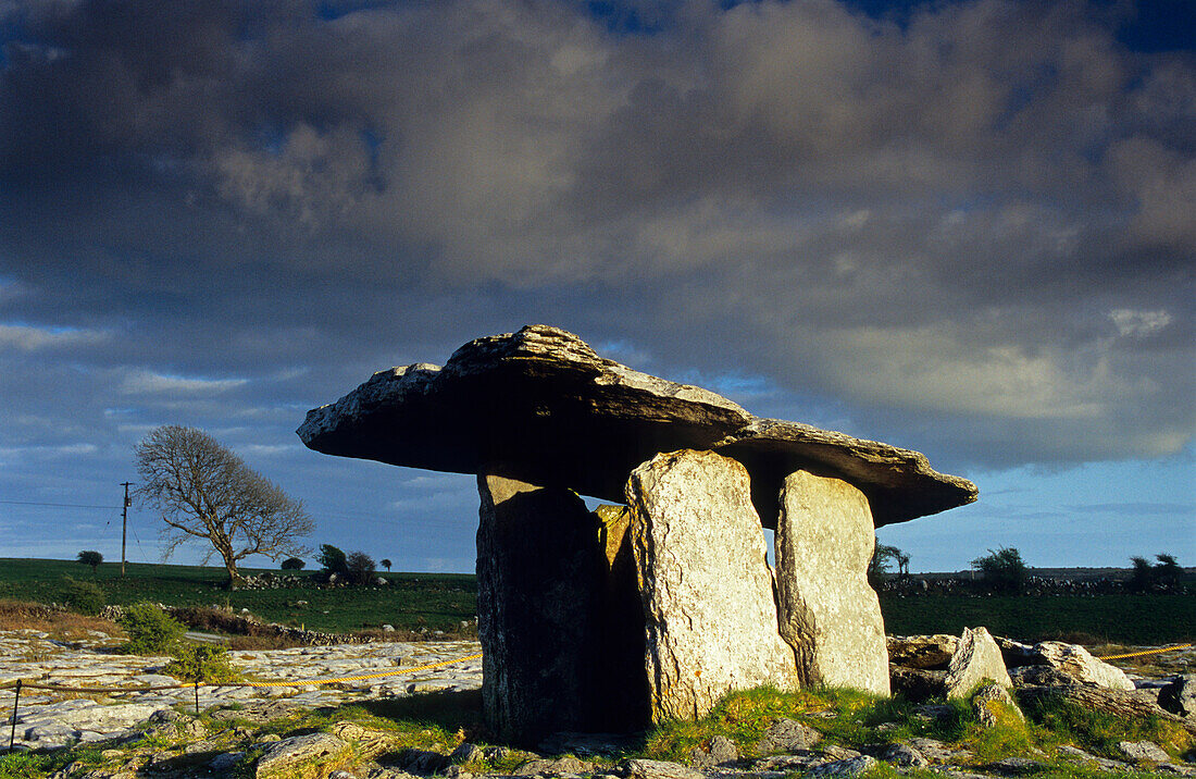 Poulnabrone Dolmen under clouded sky at the Burren, County Clare, Ireland, Europe