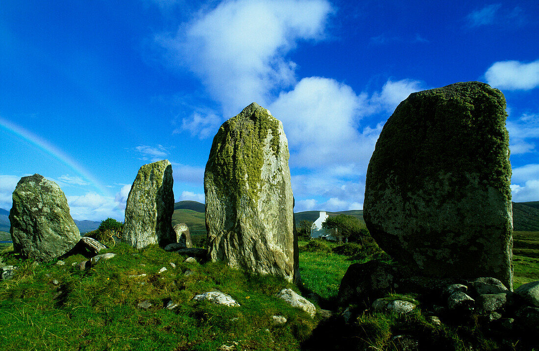 Menhirs under blue sky, County Kerry, Ireland, Europe