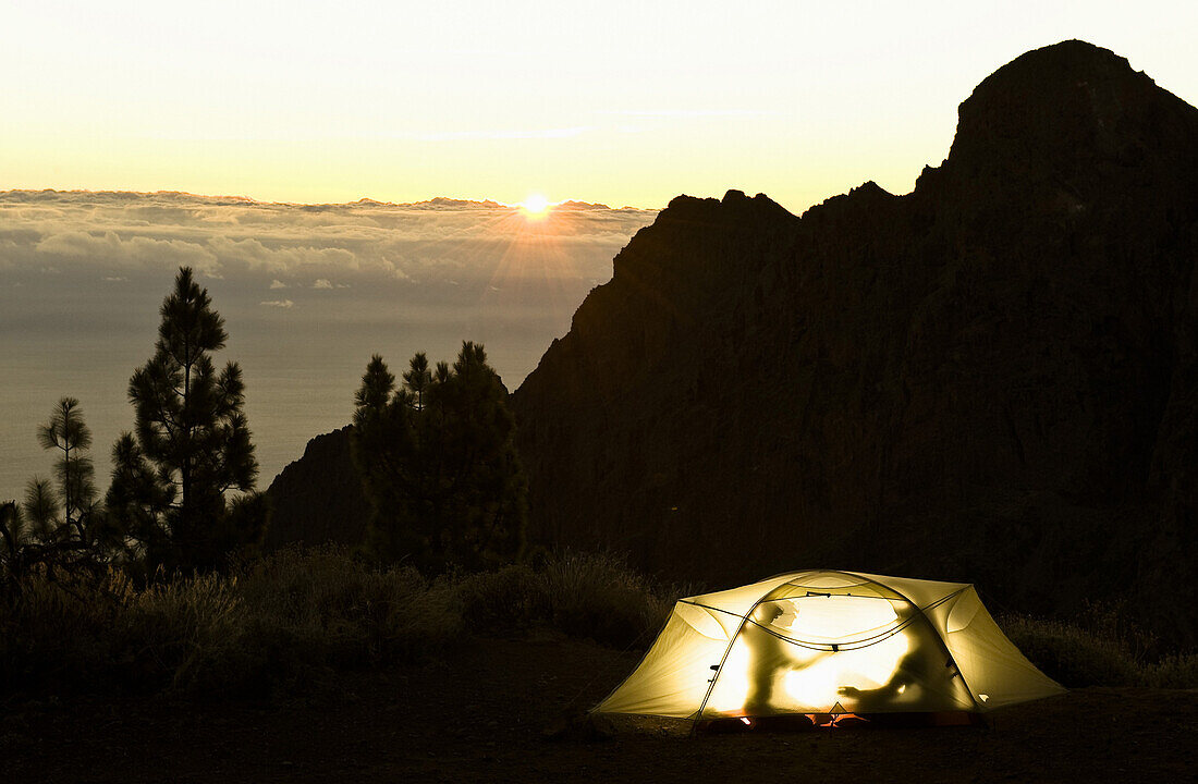 Two silhouettes in a tent in sunset, Teide National Park, Tenerife, Canary Islands, Spain