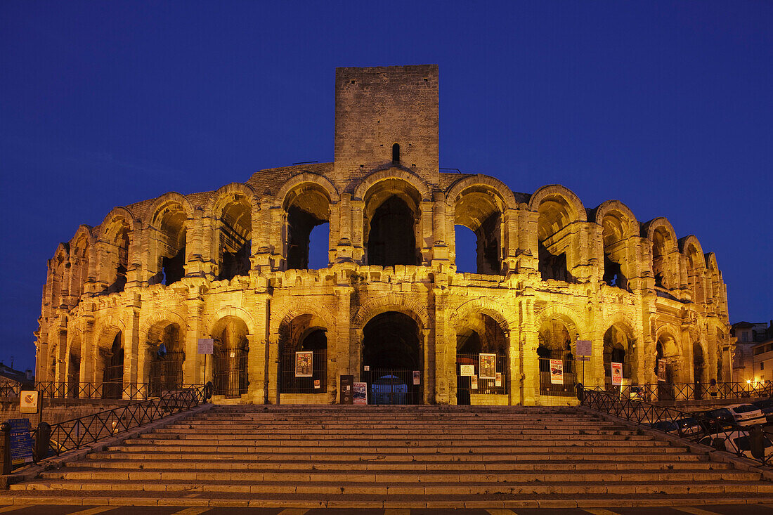 The illuminated amphitheatre in the evening, Arles, Bouches-du-Rhone, Provence, France