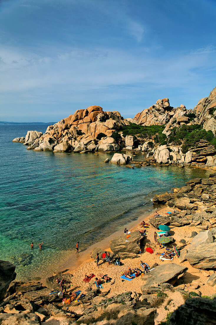 Italy Sardinia Capo Testa Cala Spinosa, sand beach with cristal clear water surrounded by bizarre rocks