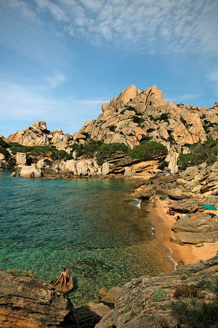 Italy Sardinia Capo Testa Cala Spinosa, sand beach with cristal clear water surrounded by bizarre rocks