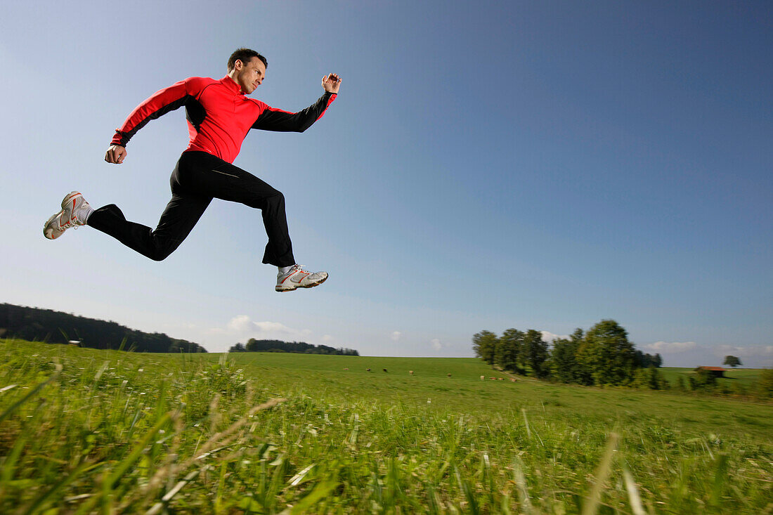 Man jumping on meadow