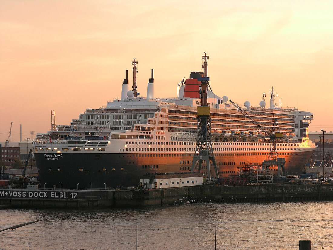 Cruise ship Queen Mary 2 at the shipyard in the evening, Hanseatic City of Hamburg, Germany