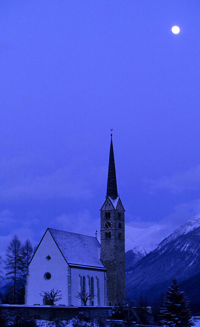 Scuol church in a moonlit winters night, Lower Engadine, Engadine, Switzerland