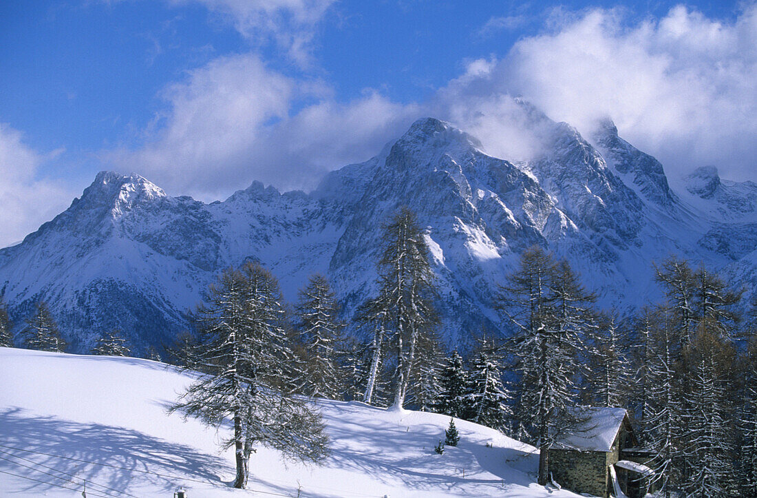 Snow covered mountain range, ski resort of Motta Naluns, Swiss National Park, Lower Engadine, Engadine, Grisons, Switzerland
