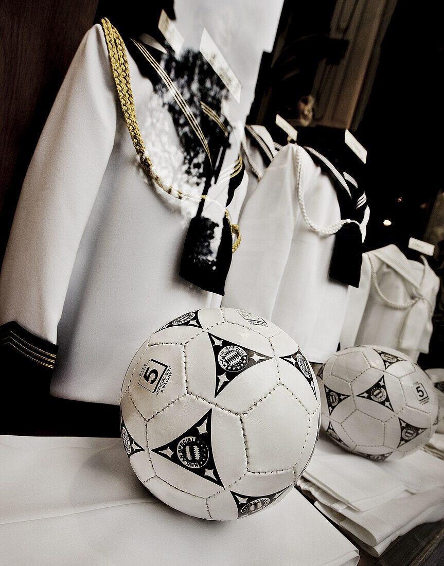 Ball, Balls, Catholicism, childhood, Christian, Christianity, Clothes, Color, Colour, Concept, Concepts, Daytime, exterior, First Communion, Football, Glass, infancy, outdoor, outdoors, outside, Reflection, Reflections, Religion, Roman Catholic, Sacrament