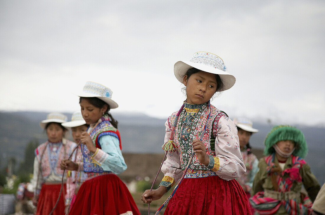Children in traditional costume dancing at Yanque, Colca Canyon, Peru