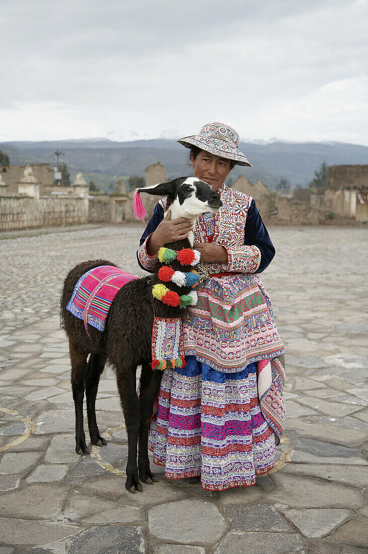Woman in traditional dress, with alpaca, Yanque, Colca Canyon, Peru
