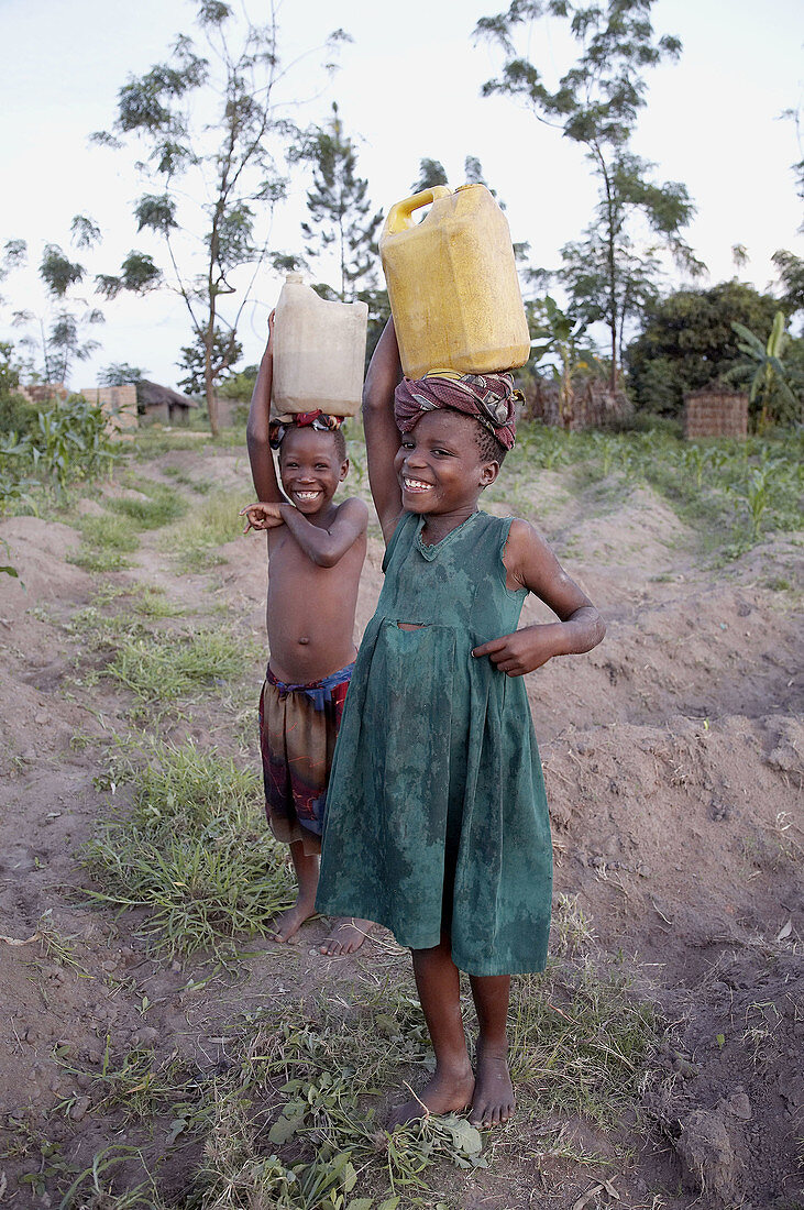 Girls carrying buckets of water, Kalabezo. Tanzania