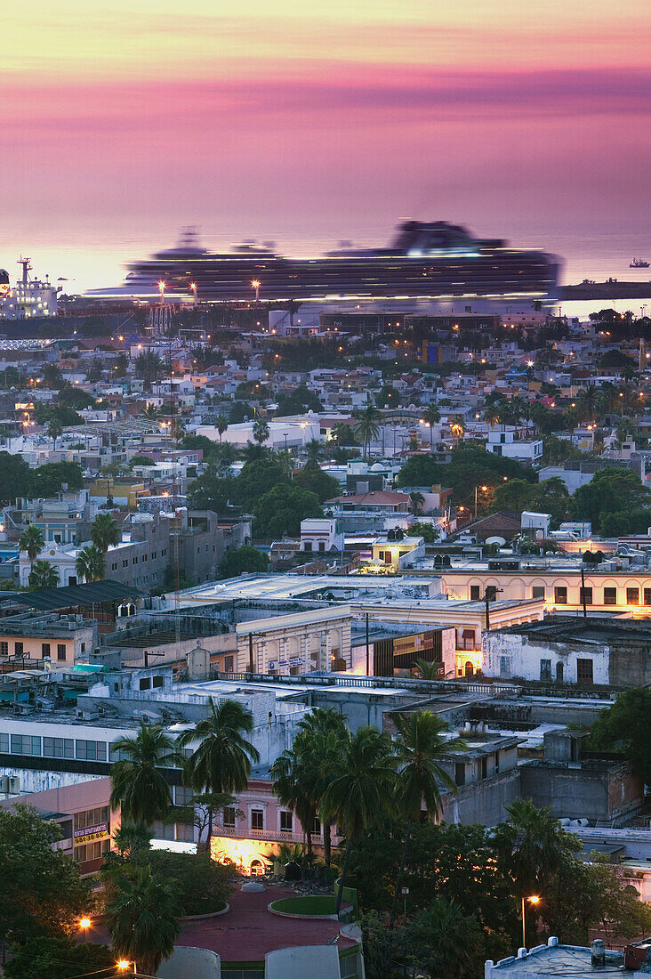 MEXICO-Sinaloa State-Mazatlan: Mazatlan View from Cerro de la Neveria Hill with moving Cruise ship/ Dawn