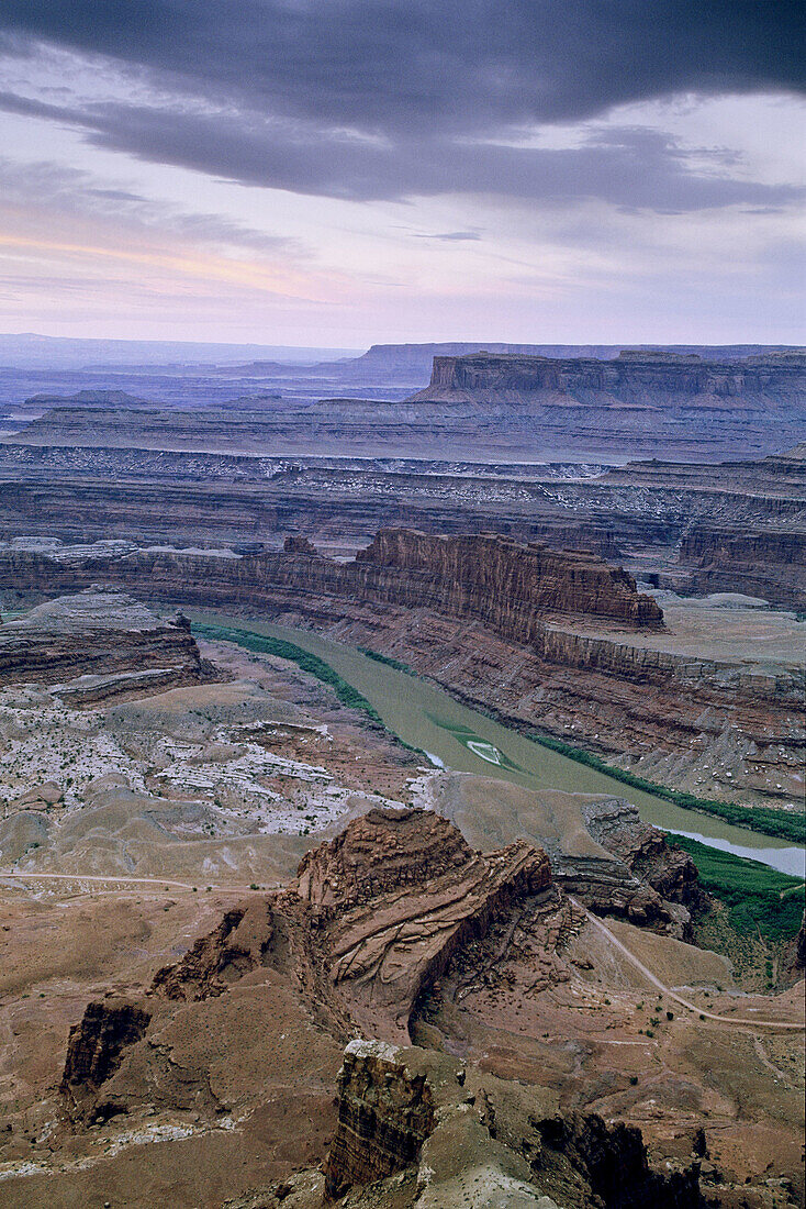 Stormy morning light over the Gooseneck, Colorado River from Dead Horse Point, Dead Horse Point State Park, Utah, USA