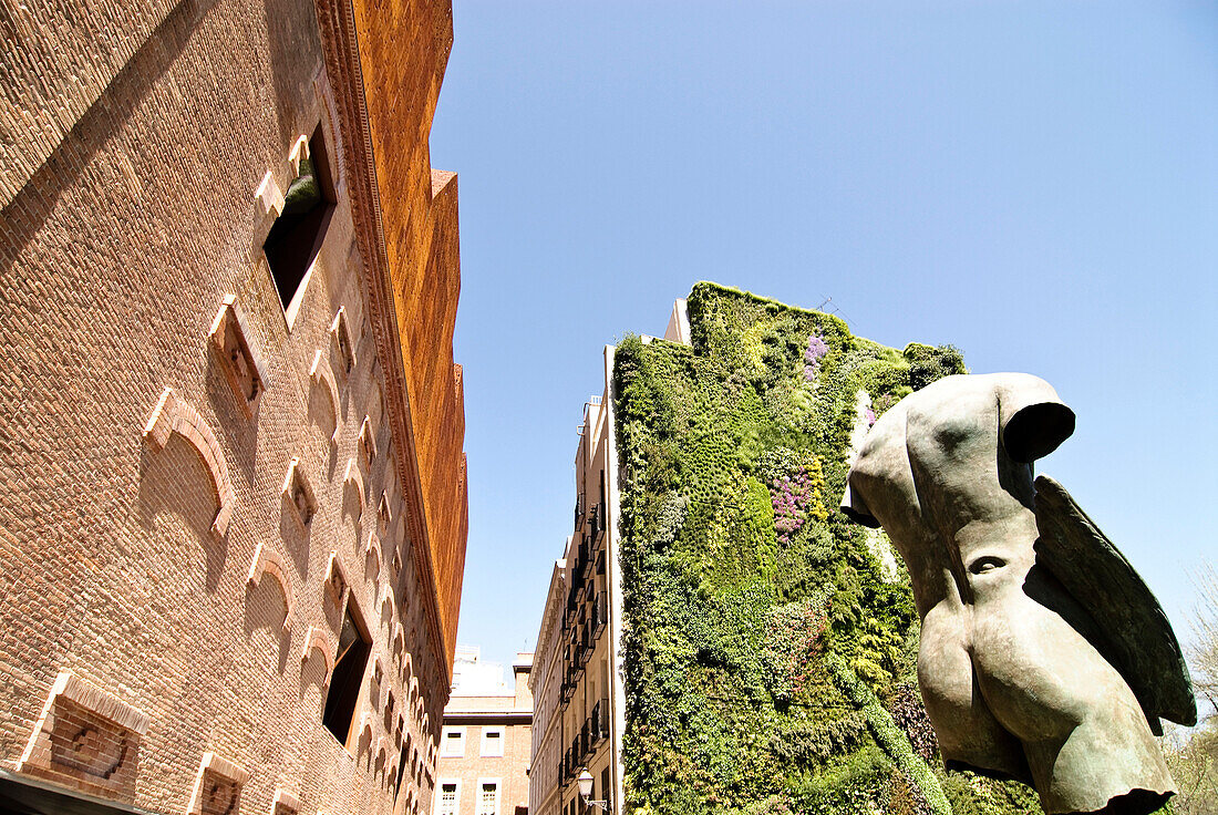 Caixa Forum, from architects Herzog & de Meuron, with sculpture from sculptur Igor Mitoraj, and vertical garden from Patrick Blanc, Madrid, Spain