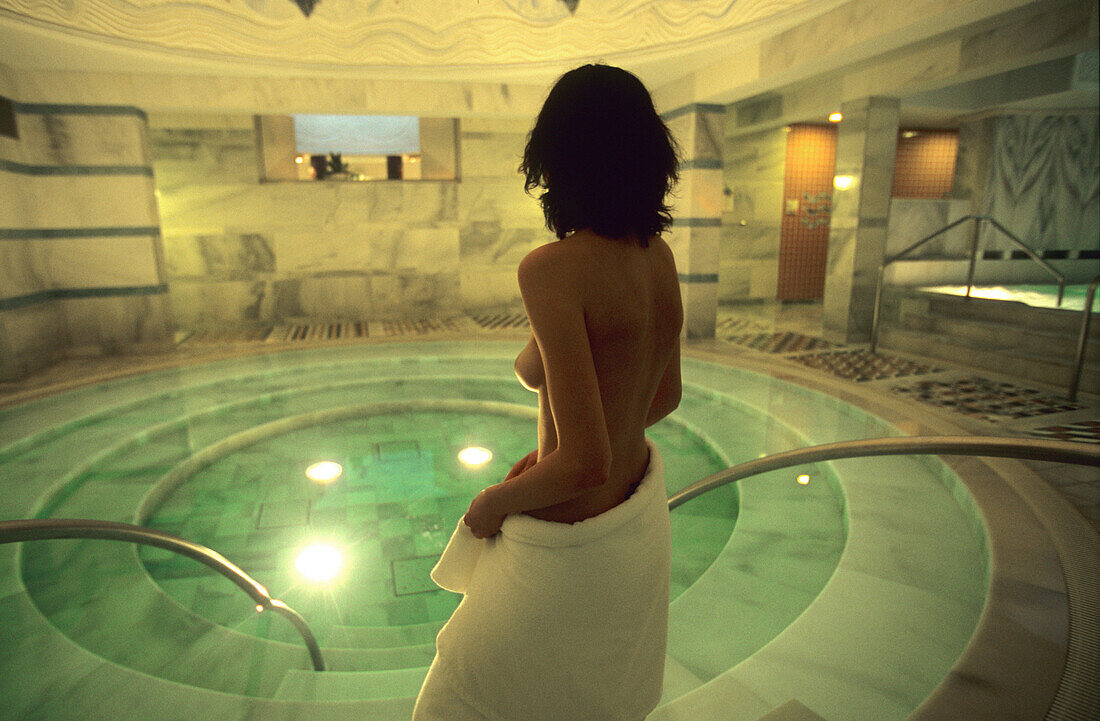 Woman at the Mineral spa pool of the Roman Irish Baths in Scuol, Lower Engadine, Engadine, Switzerland