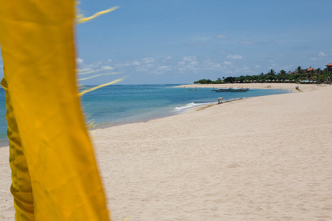 Sandy beach Nusa Dua on the peninsula Bukit Badung at the southern tip of Bali, Indonesia