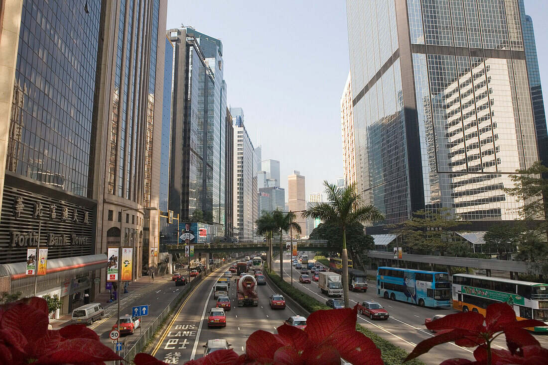Busy road between high rise buildings, Gloucester Road, Wan Chai, Hong Kong Island, Hong Kong, China, Asia