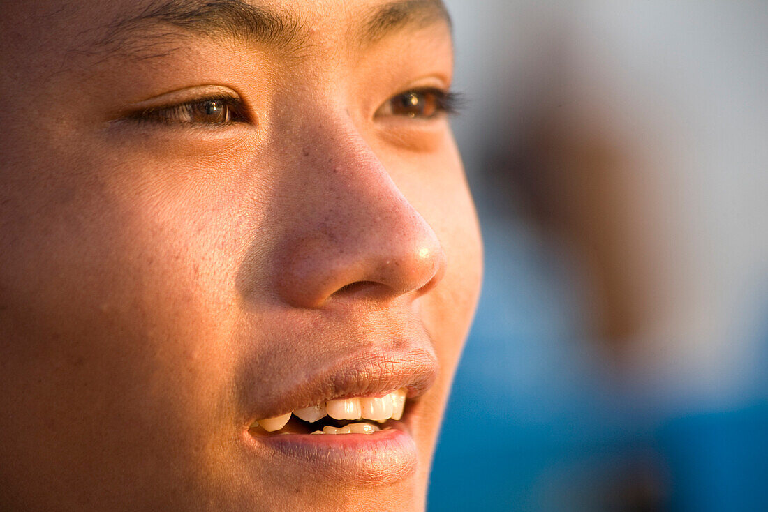 Face of a burmese boy of the Intha tribe at Inle Lake, Shan State, Myanmar, Burma