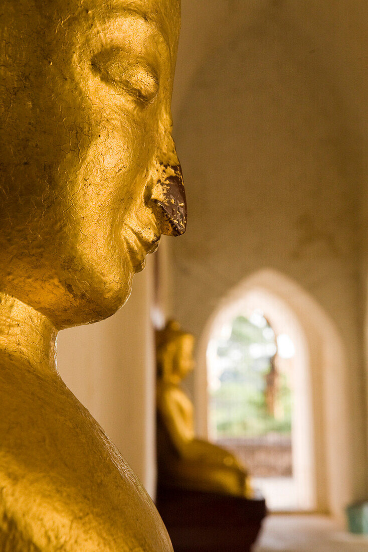 Face of a golden buddhistic figure in Bagan, Myanmar, Burma
