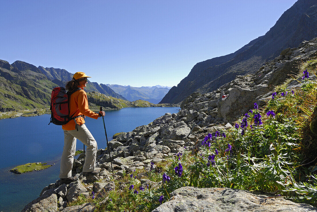 Woman hiking near lake Wangenitzsee, National Park Hohe Tauern, Carinthia, Austria