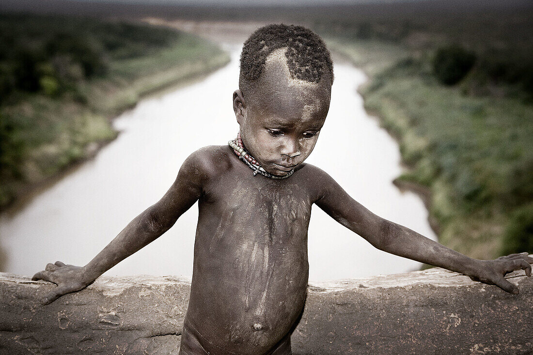 Karo boy by Omo River. South Ethiopia. African Tribes
