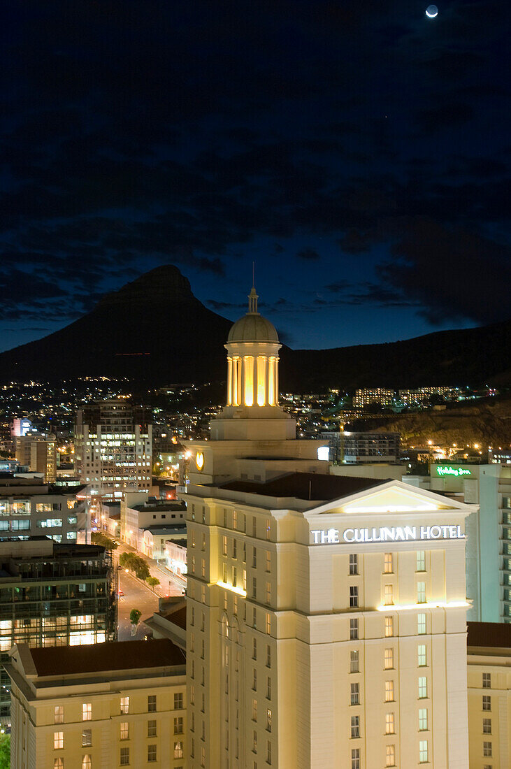 The illuminated houses of Capetown in front of the Lion's Head at night, Cape Town, South Africa, Africa