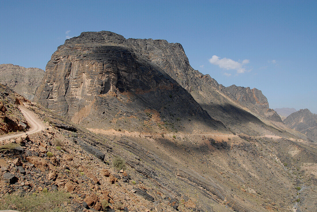 Lonesome country road in a mountain scenery, Al Hajar mountains, Oman, Asia