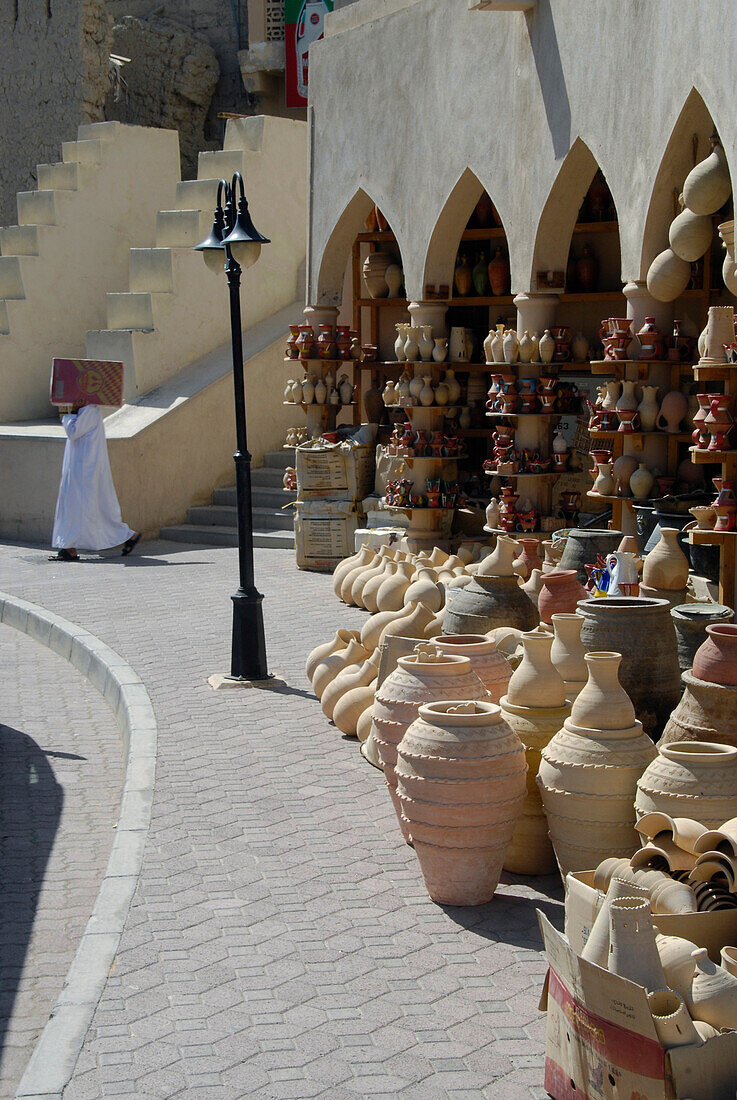 Stoneware jugs in front of a shop in the sunlight, Bahla, Oman, Asia