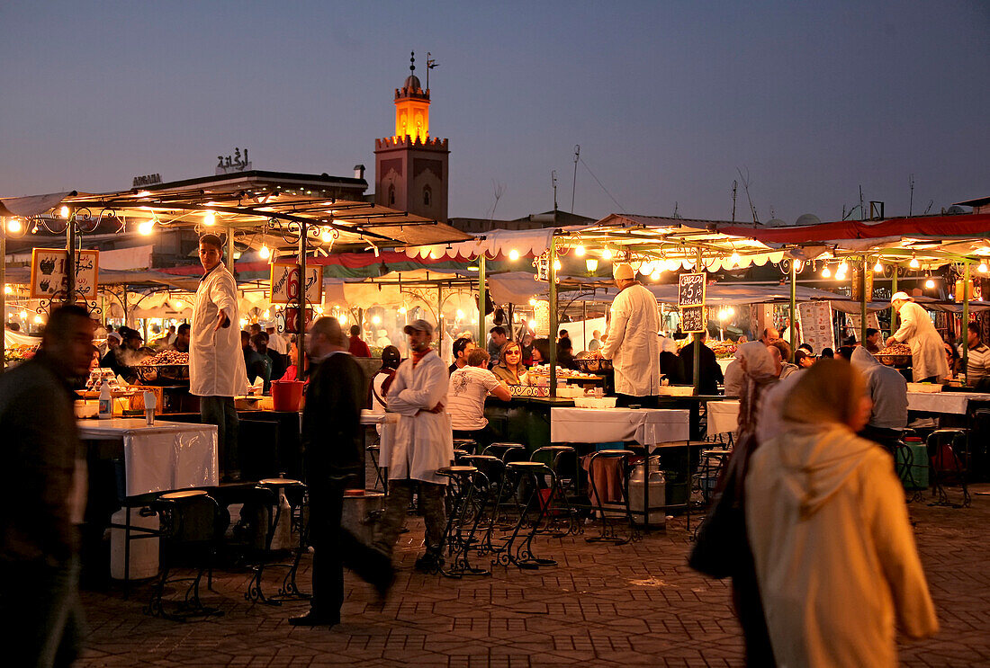 People at the market at dusk, Djamâa el-Fna square, Marrakesh, Morocco, Africa