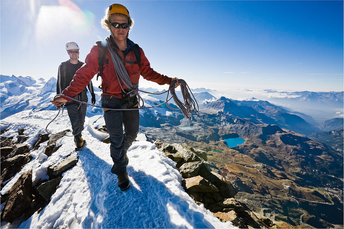Two men, a guide and his client on top of the Matterhorn, Zermatt, Valais, Wallis, Switzerland, Alps