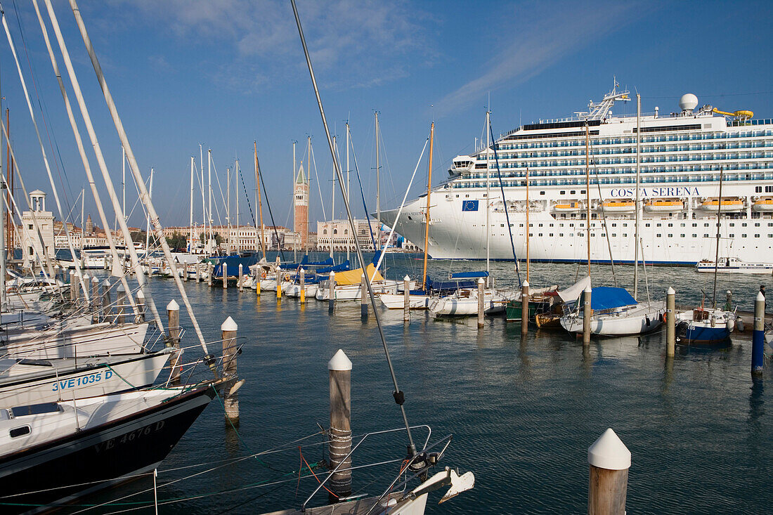 Cruiseship Costa Serena and Campanile Tower seen from San Giorgio Marina, Venice, Veneto, Italy