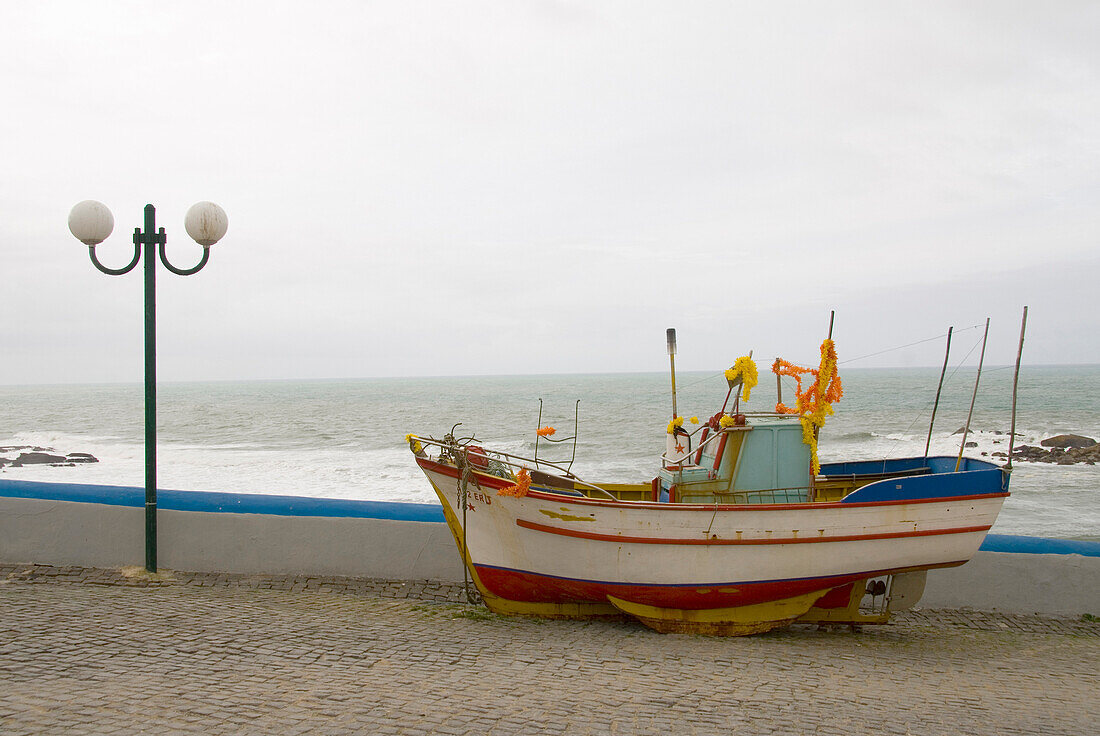 Colourful fishing boat in the historical and old fishing and seaside village Ericeira, Portugal, Atlantic