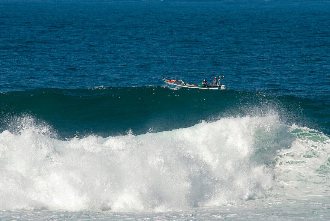 Fischermen in a boot near Guincho Beach, Costa de Lisboa, Lisbon District, Estremadura, Portugal