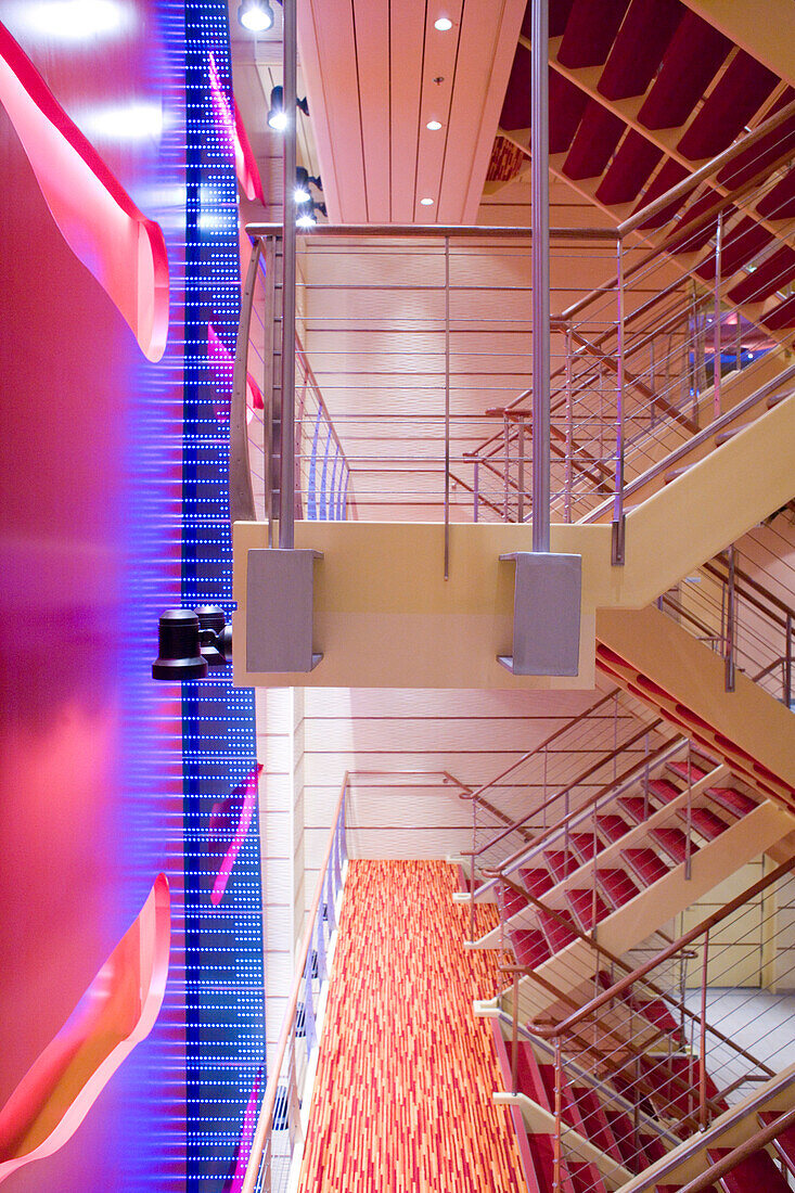 Interior view of the illuminated staircase of cruise ship AidaDiva