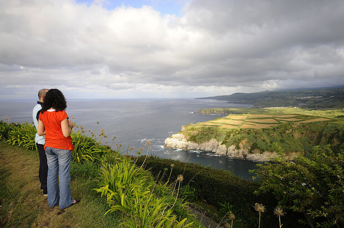 Couple admiring the view at Iria viewpoint, Northcoast, Sao Miguel Island, Azores, Portugal