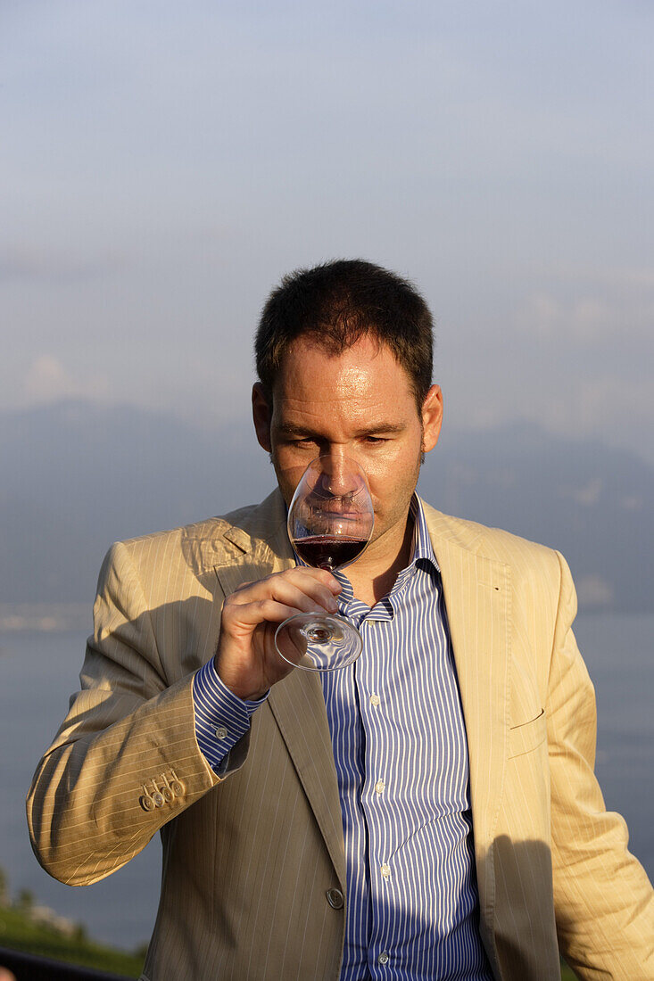 Man smelling wine, winetasting, Lavaux, Canton of Vaud, Switzerland
