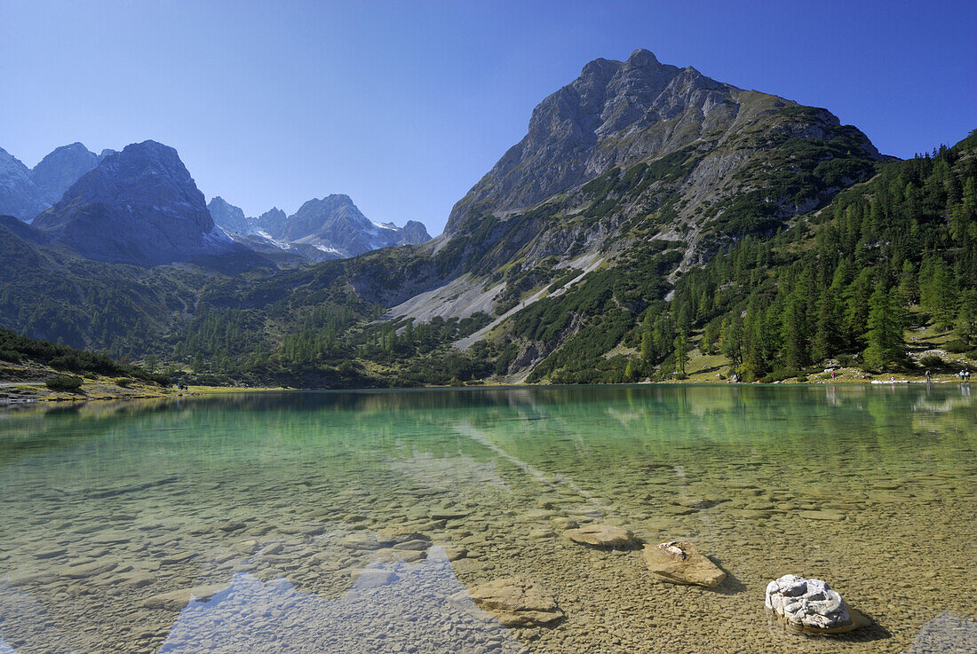 Reflection of mountains on Lake Seebensee, Mieming range, Tyrol, Austria