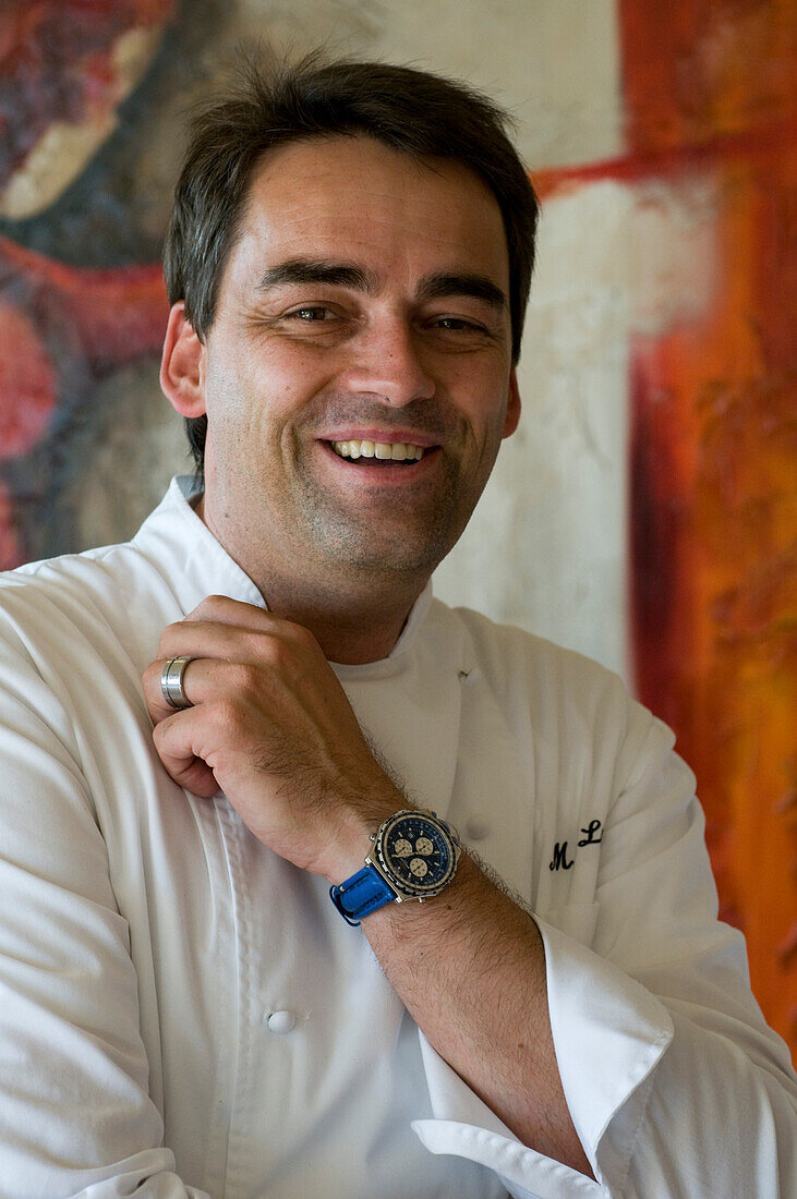 Mature man laughing, cook at the Restaurant Casala, Hotel Residenz am See, Meersburg, Lake Constance, Baden-Wurttemberg, Germany