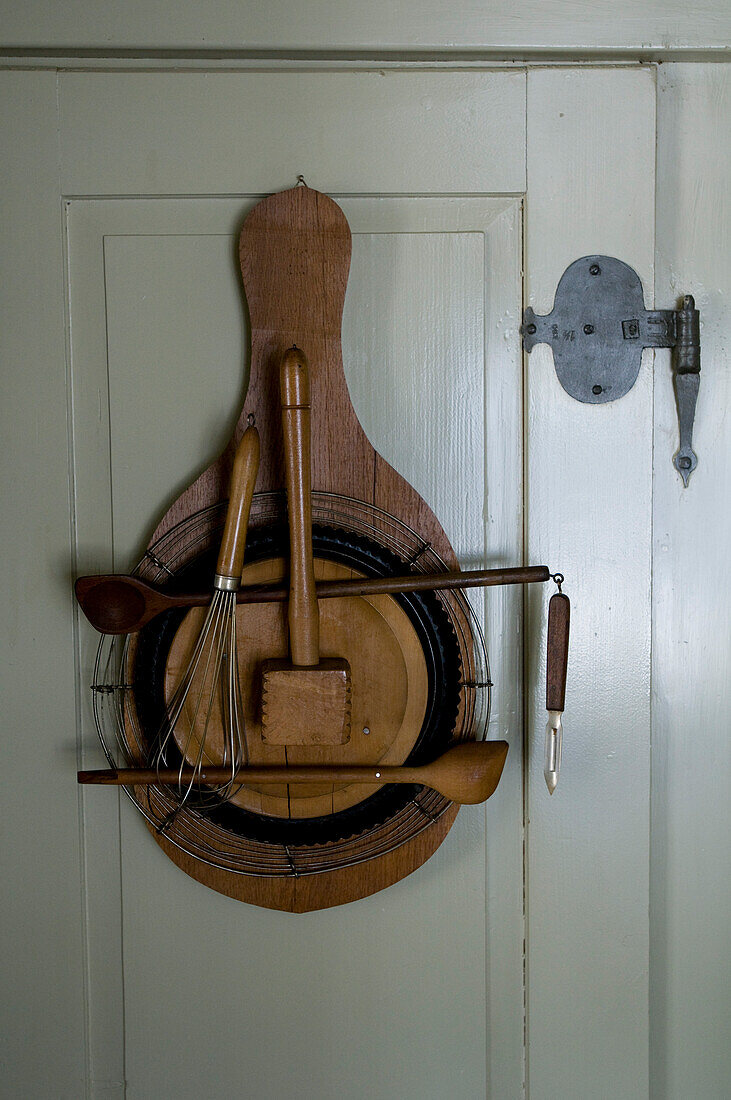 Decoration with cooking utensils hung on the door, Restaurant Taverne Zum Schäfli, Owner and head chef Wolfgang Kuchler, Wigoltingen, Lake Constance, Switzerland