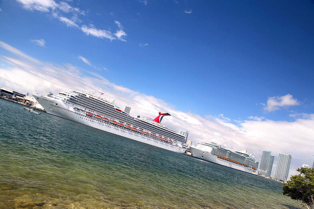 Cruise ships at the harbour of Miami under white clouds, Florida, USA