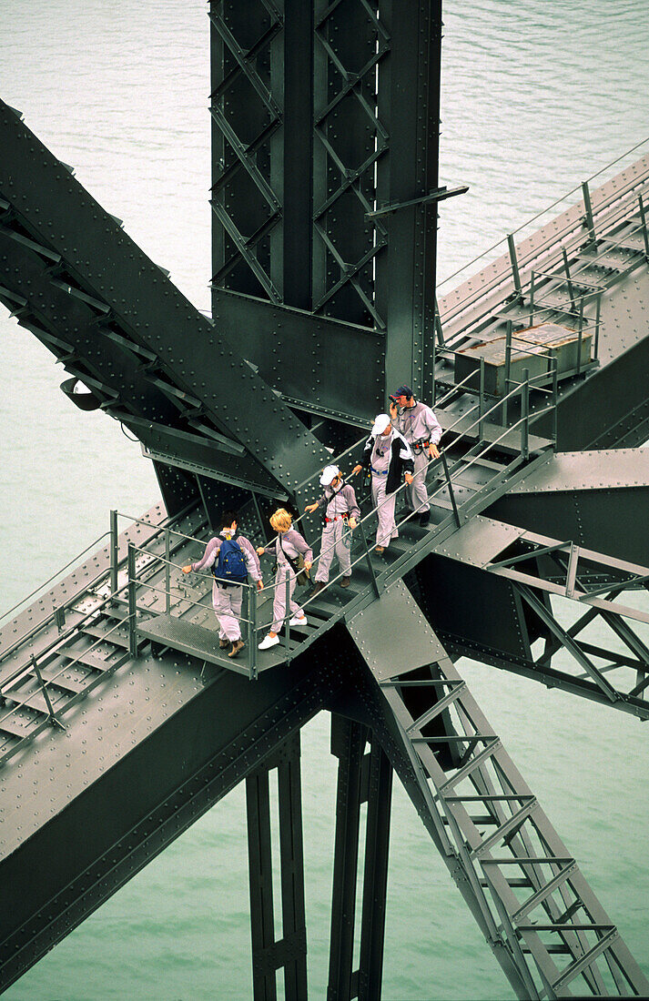 People climbing on the steel beam of the Harbour Bridge, Sydney, New South Wales, Australia