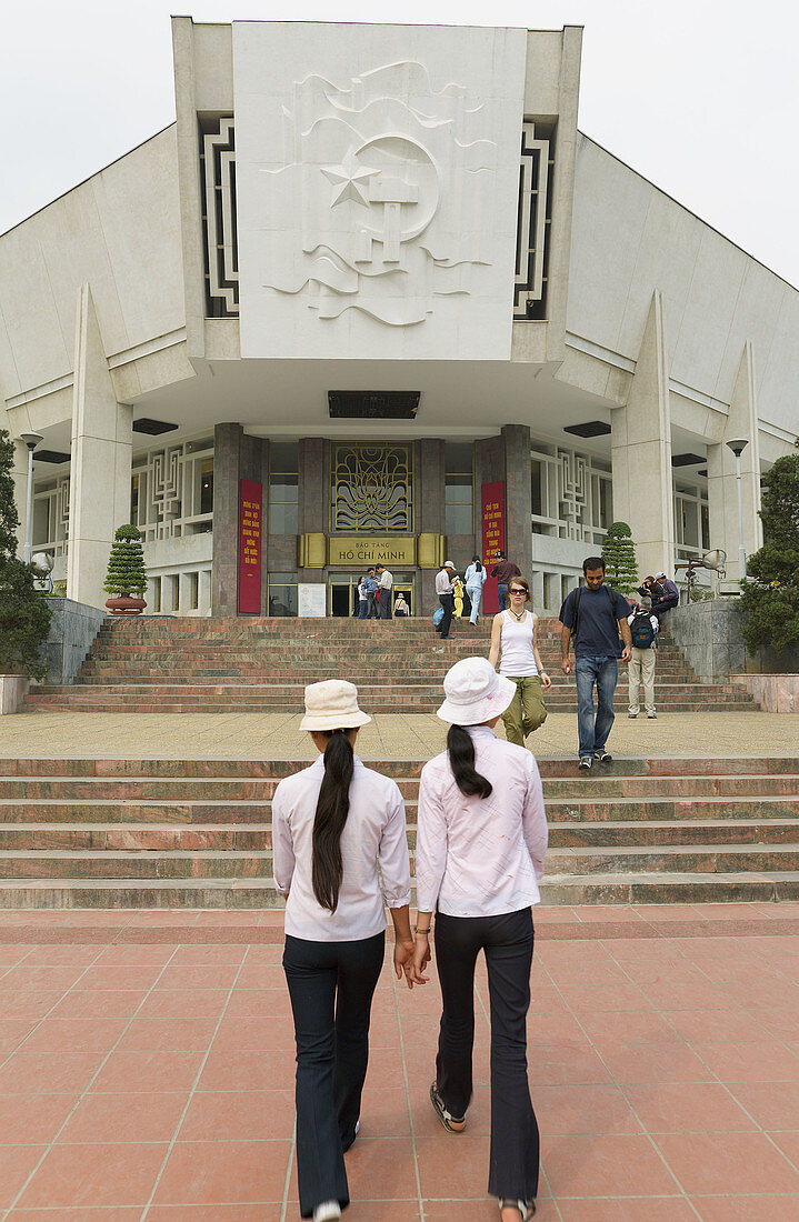 Two Vietnamese girls visiting the Ho Chi Minh Museum, Hanoi, Vietnam