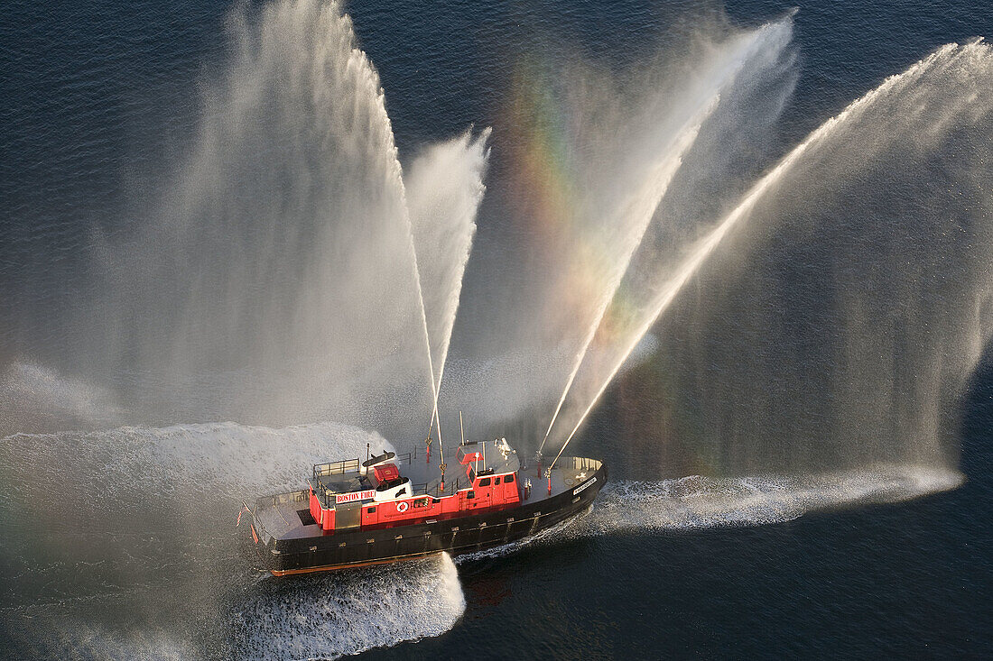 Fireboat spray, aerial view in Boston harbor, Boston, Usa.